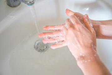 Washing hands rubbing with soap man for corona virus prevention, hygiene to stop spreading coronavirus.