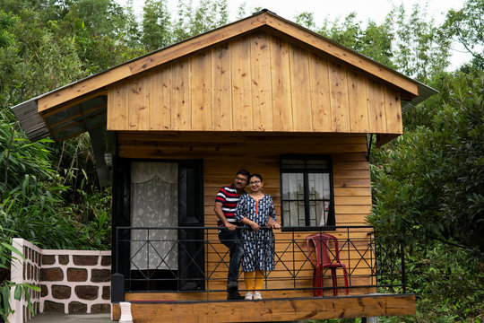 Middle aged Indian couple in a beautiful cottage