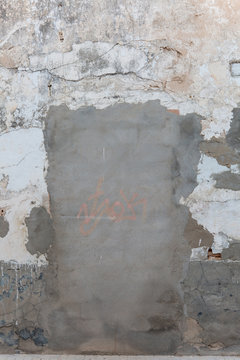 Concreted doorway in a decaying wall.