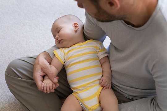 Three months old baby learning about life around him