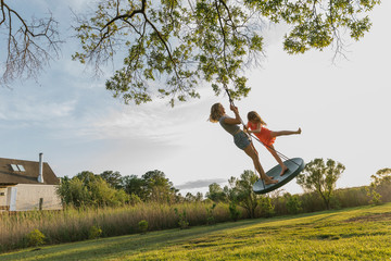 Kids Having Fun on Tree Swing