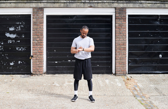 Black ethnic male checking heartbeat.