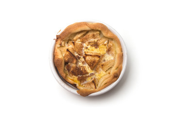 Closeup of mini tartlets in a white plate on white background on top view