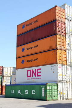HAMBURG, GERMANY - JUNE 30, 2019: Shipping containers of HAPAG-LLOYD, OCEAN NETWORK EXPRESS and UASC stacked at the Port of Hamburg
