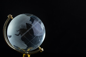 Glass globe on a black matte background
