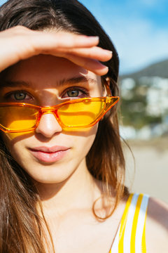 Portrait of young woman wearing sunglasses