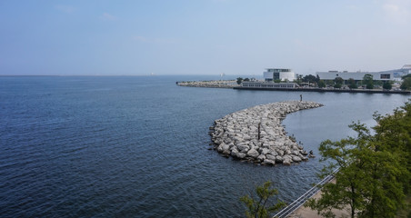 Milwaukee,Wisconsin,USA-09/03/2015. A lake view with the shore line and pier.
