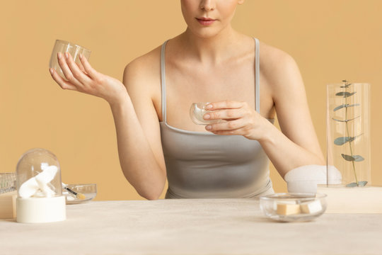 Woman Using Cosmetic Cream
