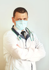 Doctor pediatrician wearing a protective mask against coronavirus. Banner panorama, medical staff, preventive equipment. Pandemic.  
Healthcare concept