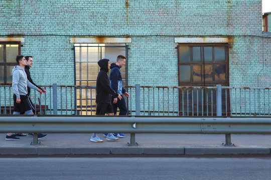 Male Athletes Walking On Street