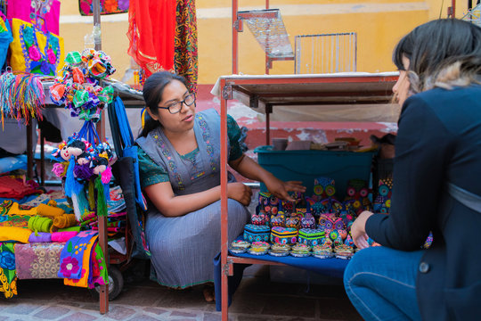 Tourist inquiring about Mexican nahuatl crafts