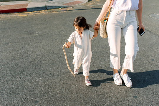 Mom and daughter walking