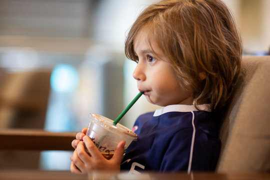 4 year old boy drinking milkshake