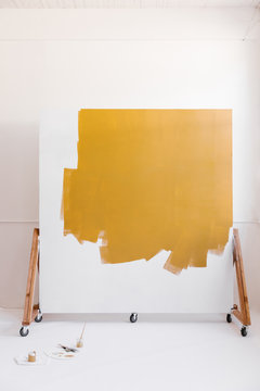 backdrop wall partially painted with golden yellow