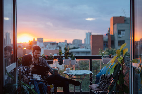 Couple looking at table computer on the house terrace