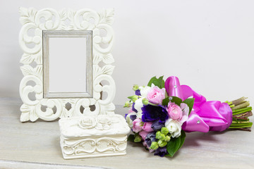 romantic-style frame, casket and bright bouquet