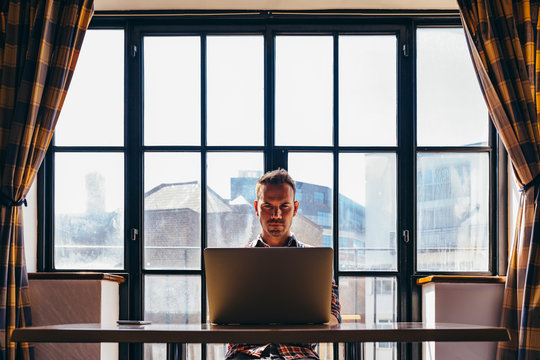 Man using laptop at home