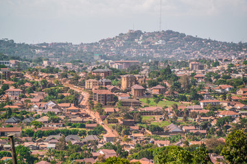 dirt road winds through village in kampala uganda africa