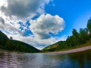 river and mountains, clouds, blue sky 