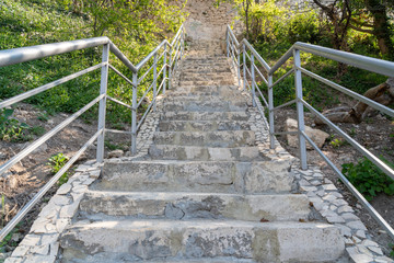 A new stone staircase of 800 steps to Jasper Beach, built in the spring of 2020. The reserve on the Black Sea. Cape Fiolent, Crimea Peninsula. The concept of unity with nature, outdoor activities.