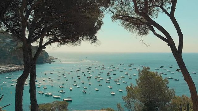 Spain Costa Brava Mediterranean coastline panning from the sea shore, Canyelles Grosses, Roses, Catalonia