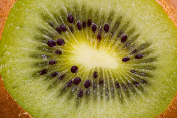 Kiwi fruit cutaway. Food macro shot.