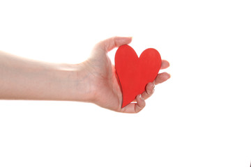 Woman hand holds a red heart