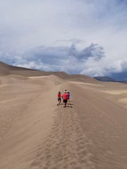 Fototapeta na wymiar Hiking a Sand Dune