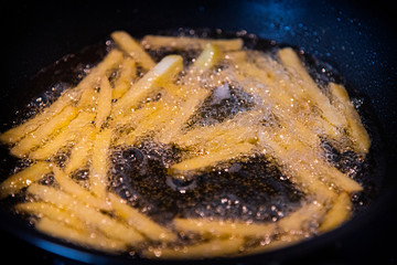 french fries in hot oil