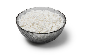 glass bowl with cottage cheese isolated on a white background