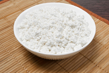 bowl with cottage cheese on the table