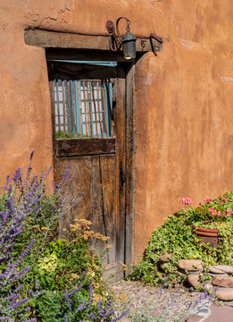 Old Faded Wooden Door in Adobe Southwest Architecture