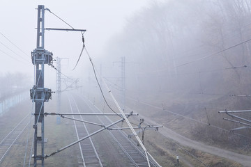 railroad rails lurking in fog