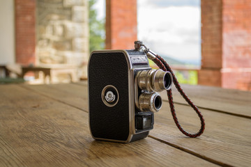 a vintage camera on a wooden table