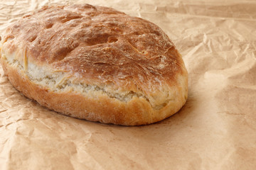 Fresh homemade wheat bread on  wooden table.