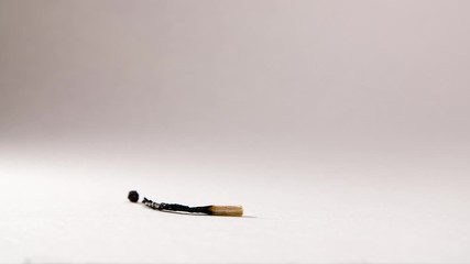 Concept of life, born and death. Macro shot, stop motion. Wooden match burning
