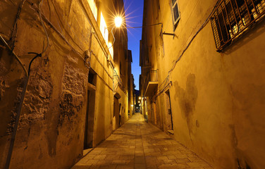 Street of Corsican city Bastia at night , Corsica island, France.