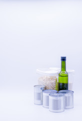 Donation box with canned food, oil, oatmeal, peas and corn, food stock for quarantine, isolation period on white. Donation, coronavirus