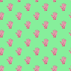 seamless pattern of pink washcloth glove for home peeling and skincare against bright green background 