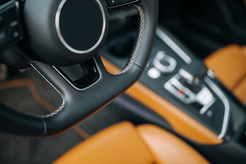 Modern car steering wheel close up