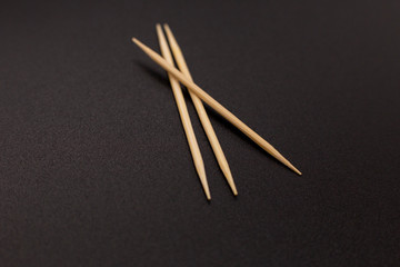 Toothpicks on a dark background. close up