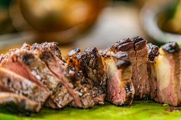 Fresh, delicious grilled meat. Grilling steak on BBQ. Close up view of grilling steak