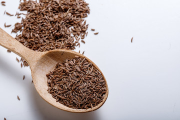 Pile of cumin seeds isolated on white background