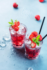 Red cocktail with ice and mint