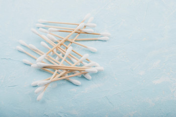 Set of bamboo cotton buds on a blue background. Wooden cotton buds for ear. Zero waste