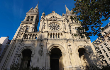 The Saint-Ambroise church soars into blue sky in French capital Paris.