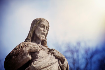 Antique statue of Jesus Christ as divine savior of the world. Religion, Christianity, faith, immortality concept.