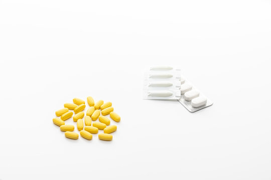 Packing oval yellow pills, tablets, pastils. Isolated on a white