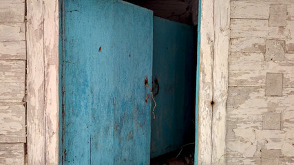 old blue wooden door with lock