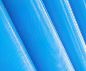 Stack of new blue pipes (tubes)